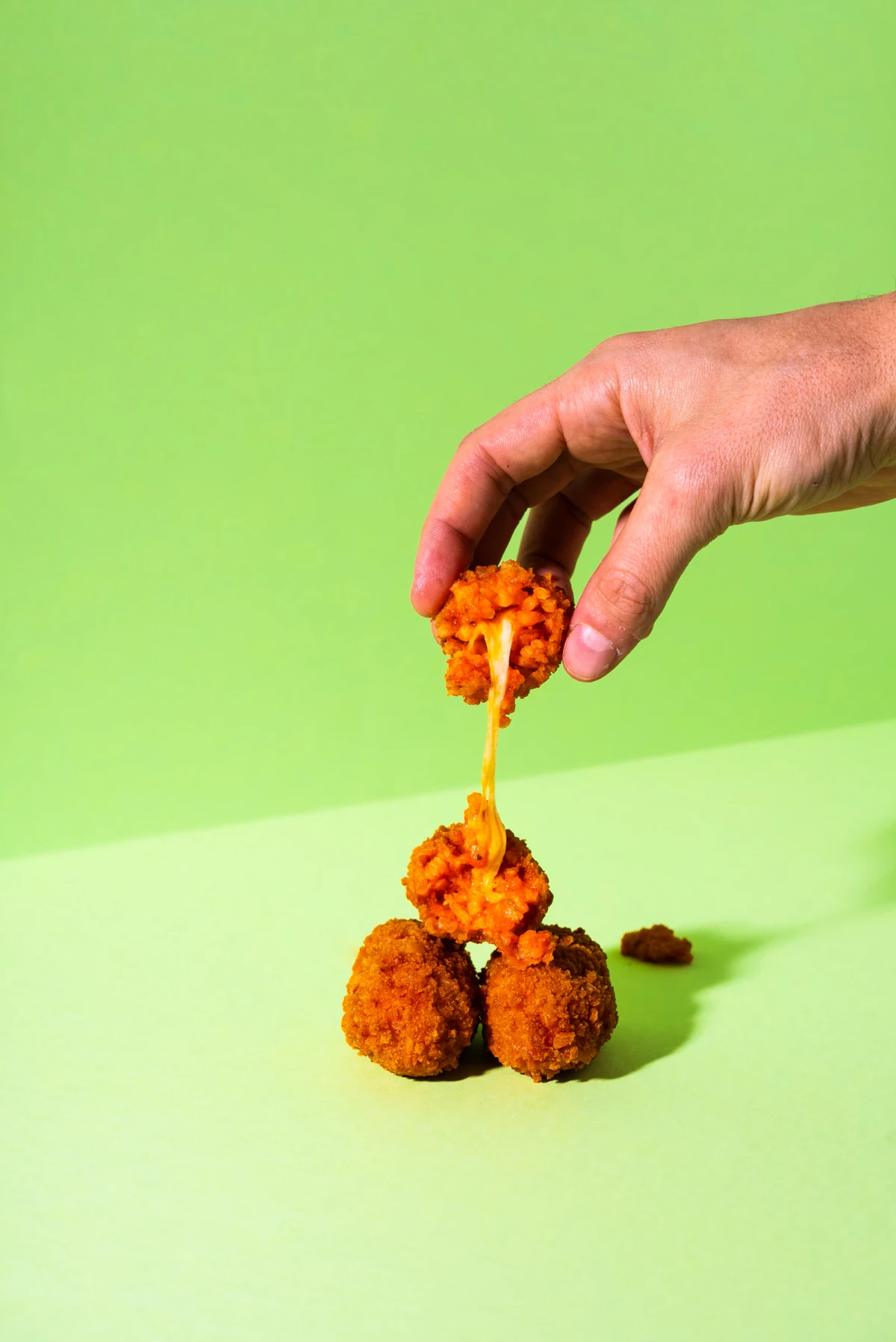 Close-up of the coarse breadcrumb coating on tomato and basil mini supplì